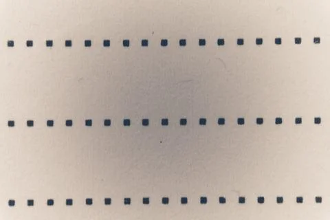 A pattern of dark squares on a light background. Stock Photos