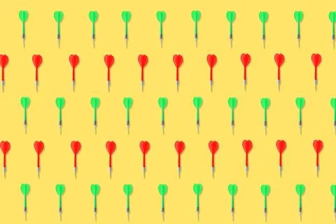 Pattern of darts on pale orange background 스톡 사진