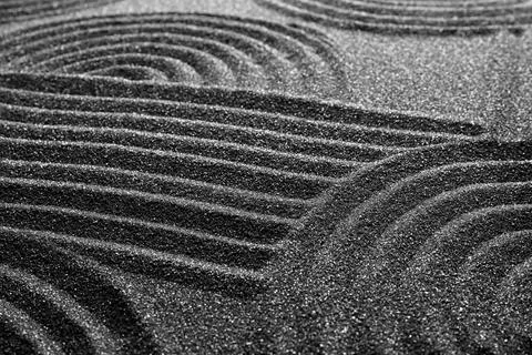 Pattern on decorative black sand, closeup. Zen and harmony Stock Photos