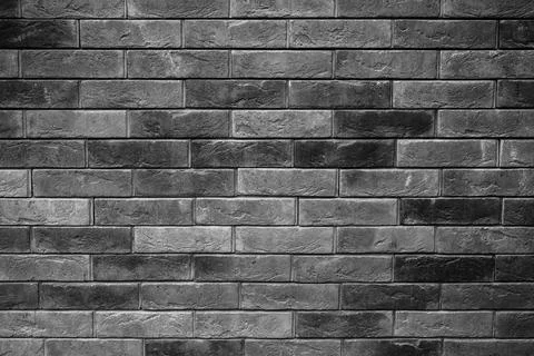 Pattern of decorative black slate stone wall surface as a background Stock Photos