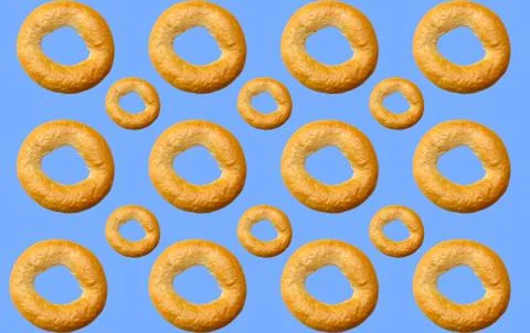 Pattern of delicious bagels on a blue background. Fotos Stock