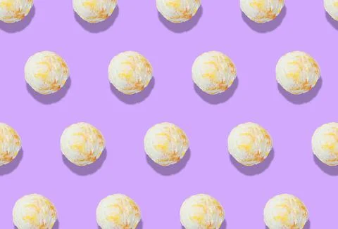 Pattern of delicious ice cream scoops on violet background Stock Photos
