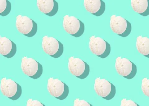 Pattern of delicious ice cream scoops on turquoise background 写真素材