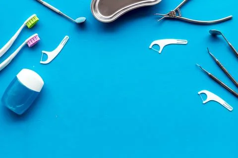 Pattern of dentist equipment. Tools, toothbrushes, dental floss flat lay Stock Photos