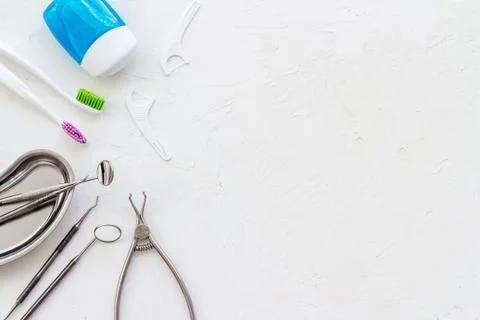 Pattern of dentist equipment. Tools, toothbrushes, dental floss flat lay Stock Photos