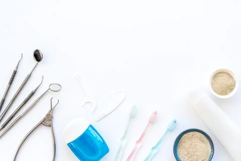 Pattern of dentist equipment. Tools, toothbrushes, dental floss flat lay Stock Photos