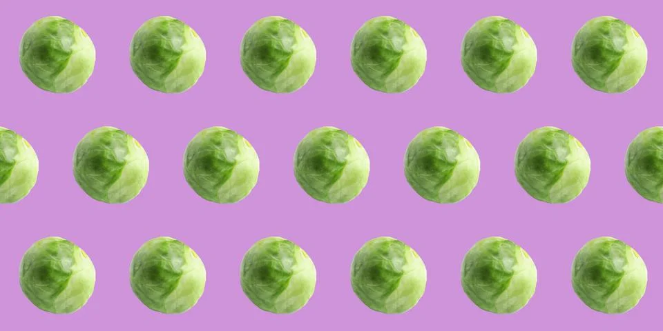 Pattern design of fresh Brussels sprouts on violet background. Banner Stockfoto's