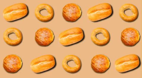 Pattern with different bakery products on a beige background. Stock Photos