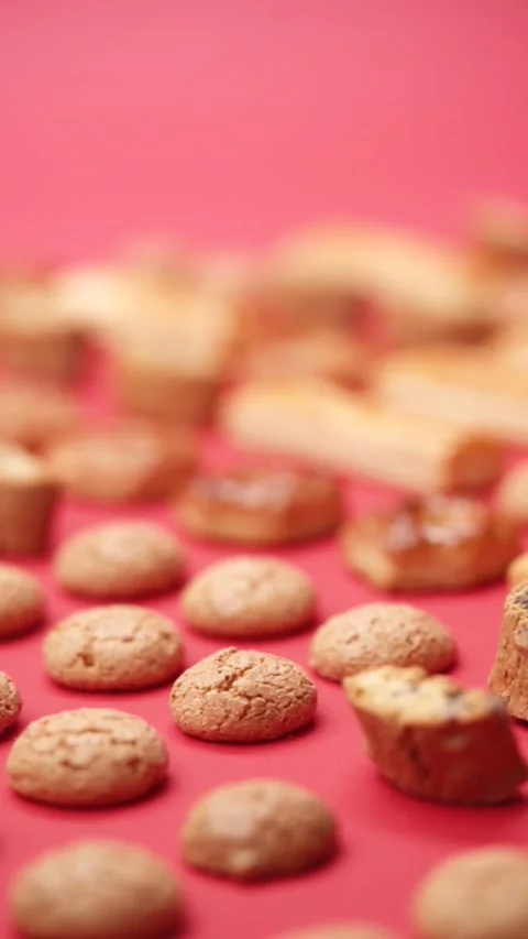 A pattern of different cookies laid out on a red background Stock Footage 171738669