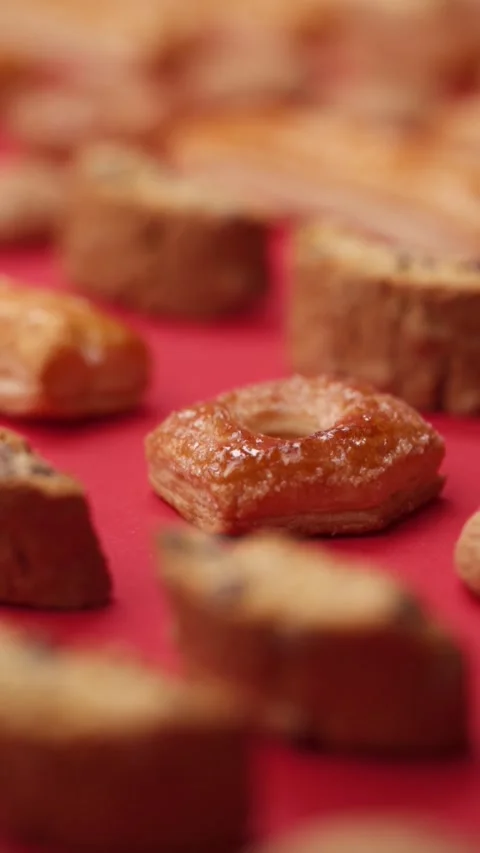 A pattern of different cookies laid out on a red background Stock Footage 171738898