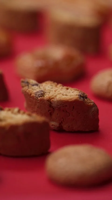 A pattern of different cookies laid out on a red background Stock Footage 171738975