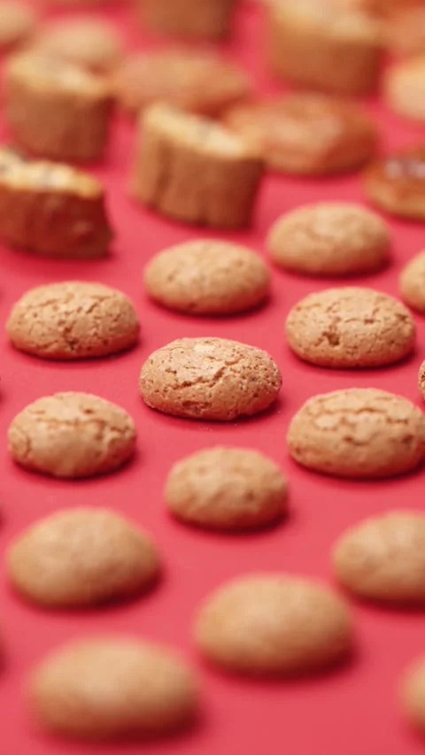 A pattern of different cookies laid out on a red background Stock Footage 171739659