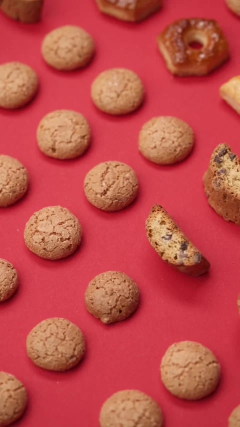 A pattern of different cookies laid out on a red background Stock Footage 171747266