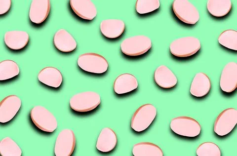 A pattern of different slices of sausage with a shadow on a blue background.  Stock Photos