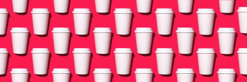 Pattern of disposable coffee cups on a red background. Stock Photos