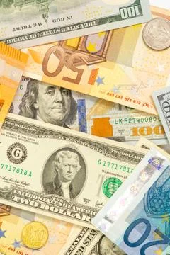Pattern of dollar and euro bills on a white background Foto stock
