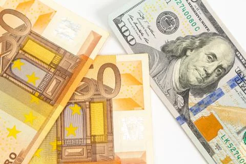 Pattern of dollar and euro bills on a white background Foto stock