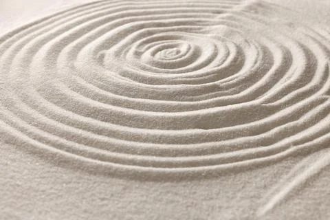 Pattern drawn on white sand, closeup. Zen garden Stock Photos