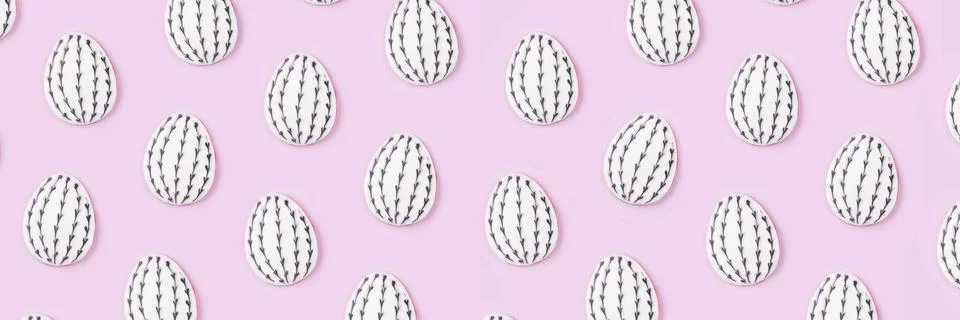 Pattern of Easter egg cookies on lilac background. Stock Photos