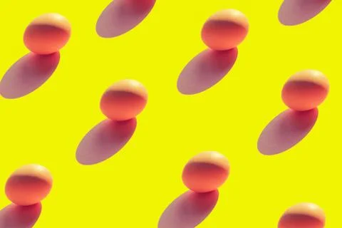 Pattern of eggs on a yellow background top view of Flat lay Stock Photos