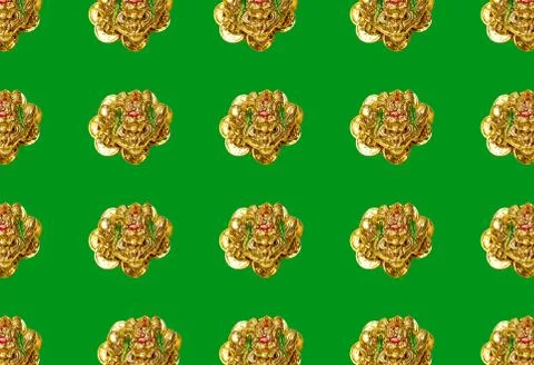Pattern with a figure of a money toad or money frog on a green background. Sy Stock Photos