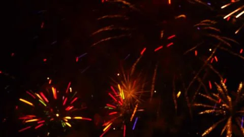 Pattern of fireworks in the evening sky Stock Photos