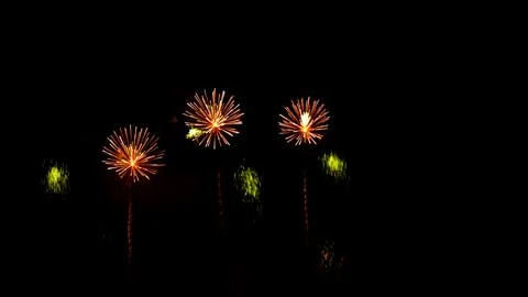 Pattern of fireworks in the evening sky Stock Photos