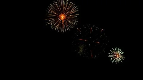 Pattern of fireworks in the evening sky Stock Photos