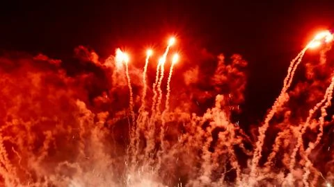 Pattern of fireworks in the evening sky Stock Photos