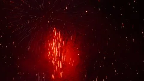 Pattern of fireworks in the evening sky Stock Photos