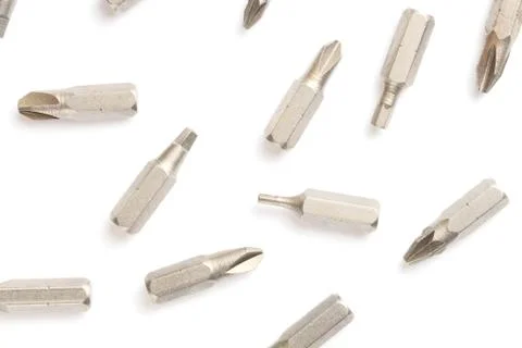 Pattern, flat lay screwdriver bit set close-up, white background. Stock Photos