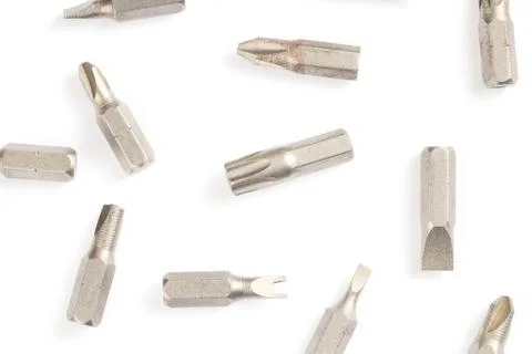 Pattern, flat lay screwdriver bit set close-up, white background. Stock Photos