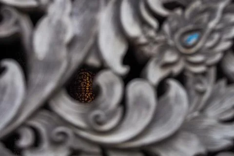 Pattern of flower carved on wall but focus in sight Photos
