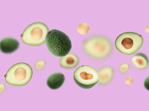 Pattern with flying avocado on bright violet background. Stock Photos