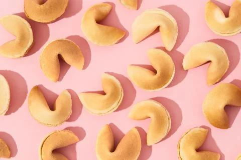 Pattern with fortune cookies on pink background with deep long shadows Stock Photos
