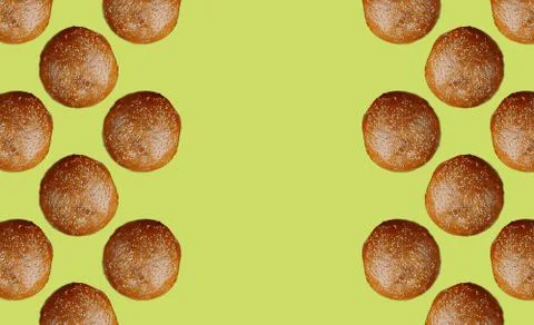Pattern with framed burger buns on a yellow background. Copy space Stock Photos