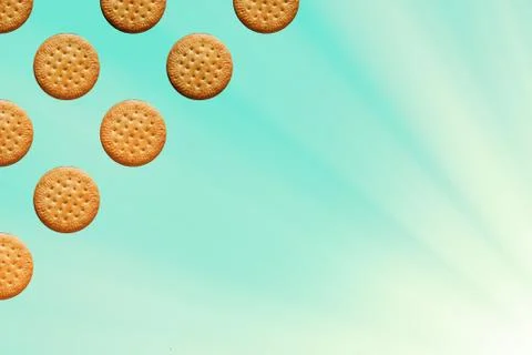 Pattern with framed round cookies on a light blue background with sunlight ef Stock Photos