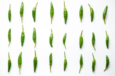 Pattern of fresh green bird's eye chilies or cabe rawit hijau arranged in a grid Stock Photos