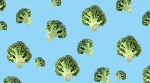 Pattern of fresh green broccoli on light blue background, banner design Stock Photos