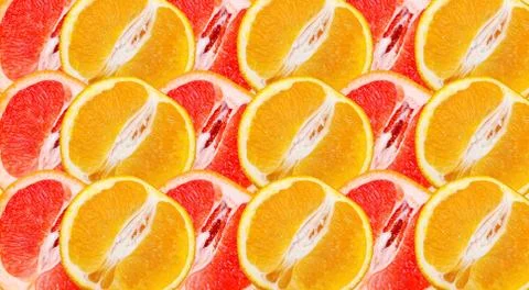 Pattern of fresh orange and grapefruit halves. Foto stock