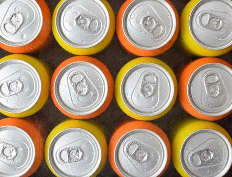 Pattern of fresh orange and yellow drink cans 写真素材