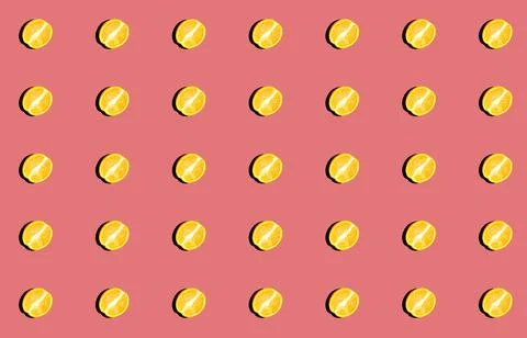 Pattern with fresh orange halves with a shadow on a pink background. Stock Photos