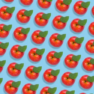 Pattern of fresh red apples on light blue background Stock Photos