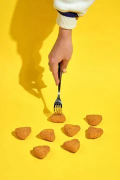Pattern of fried mozzarella with breaded fries on a yellow background. Creati Stock Photos