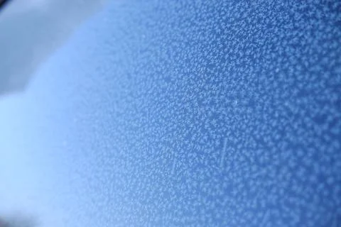 Pattern on frozen glass. unusual pattern on frozen glass. crystals of snow an Stock Photos