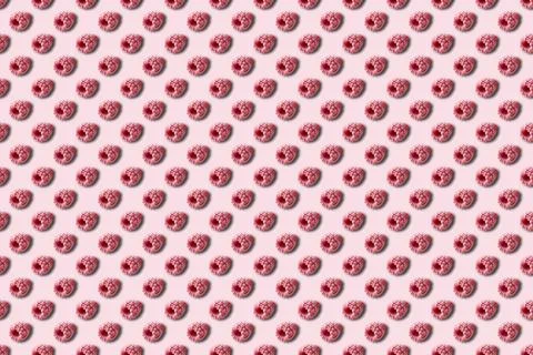 Pattern of frozen raspberry berries on a pink background. 스톡 사진