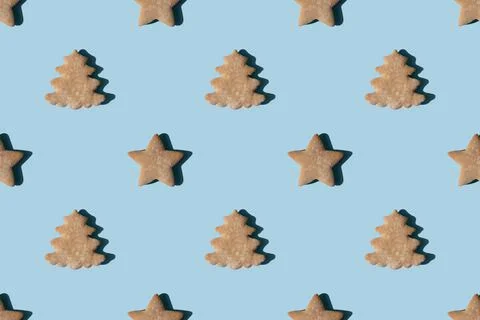 Pattern of gingerbread in the shape of stars and Christmas trees Stock Photos