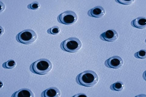 Pattern of googly eyes on lilac background Stock Illustration