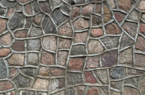 Pattern of grainy granite stones in brown, gray, pink shades with cement contour Stock Photos