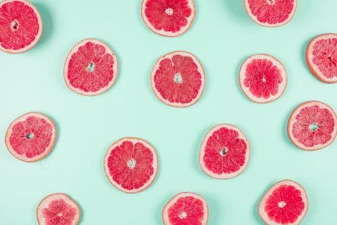 Pattern grapefruit citrus slices pastel backdrop. High quality and resolution Stock Photos